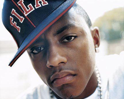 Close-up portrait of a young man wearing a Fila cap, showing a serious expression.